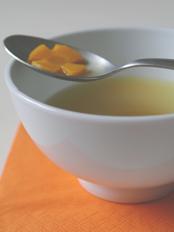 Ginger broth with carrot blossoms